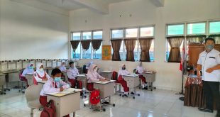 Ilustrasi siswa sekolah dasar yang belajar menggunakan masker . Foto : Dok Sumselheadline.