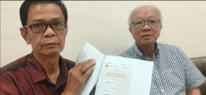 Fahmi Raghip,SH,MH dan kliennya , Alex Suherman Salim. Foto: Sumselheadline/Ela.