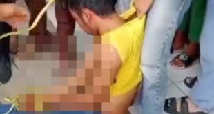 Pencuri hanphone yang babak belur dihajar massa. Foto: screenshot medsos.