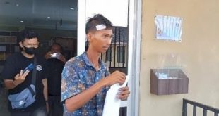 Otong melapor ke Polrestabes Palembang karena dinaiaya pemalak, Selasa (6/8/2024). Foto: Sumselheadline/Ela.