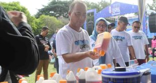 Sekda Muba, Apriyadi di sela senam dan launching Gebyar QRIS di halaman Pemkab Muba. Foto: Kominfo Muba.