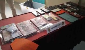 kepsek-40kb Barang bukti yang diamankan penyidik Polda Sumsel atas OTT terhadap sejumlah ASN Diknas Banyuasin. Foto: IST/sripoku.com.